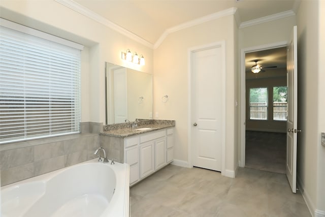 bathroom featuring vanity, a bathing tub, ceiling fan, and ornamental molding