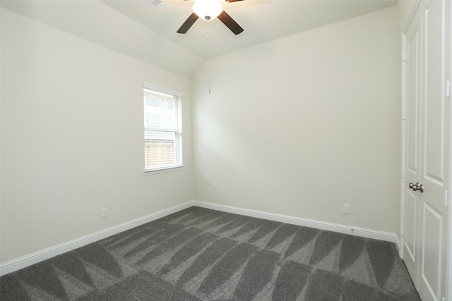 carpeted empty room featuring lofted ceiling and ceiling fan