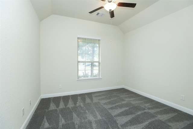 carpeted spare room with ceiling fan and lofted ceiling