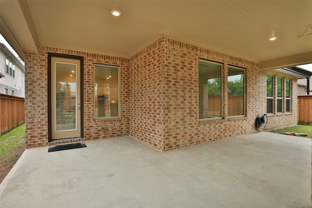 property entrance featuring a patio area