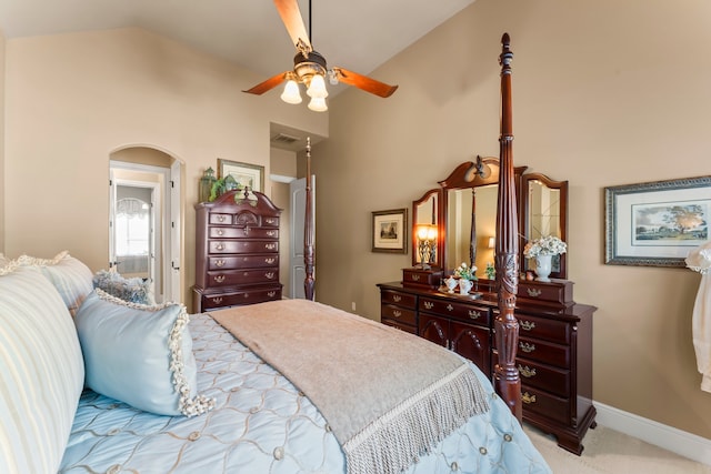 carpeted bedroom featuring ceiling fan and vaulted ceiling