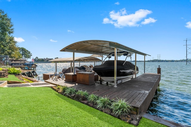 dock area featuring a yard and a water view