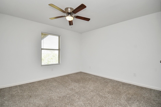 empty room featuring ceiling fan and carpet floors