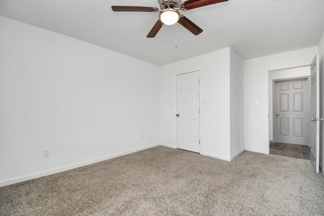 unfurnished bedroom with ceiling fan, a closet, and carpet