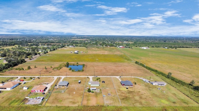 birds eye view of property with a rural view