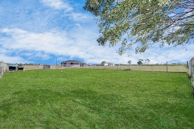 view of yard with a rural view