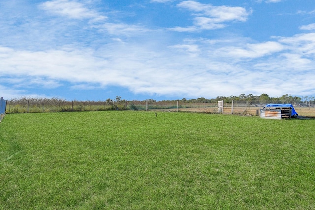 view of yard with a rural view