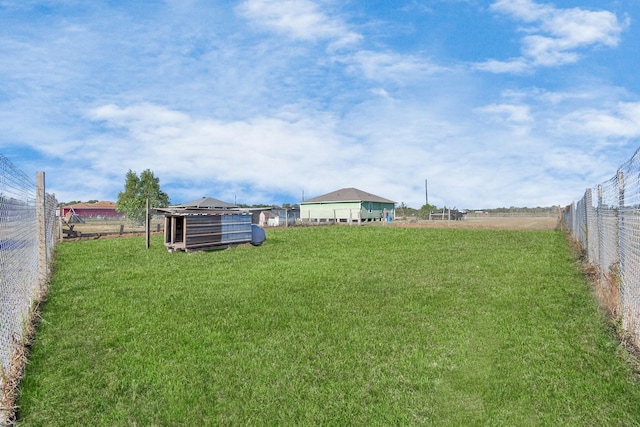 view of yard with a rural view