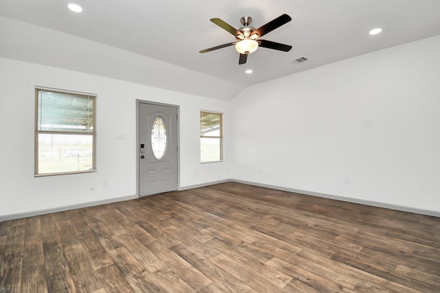 foyer entrance featuring ceiling fan, wood-type flooring, a wealth of natural light, and vaulted ceiling