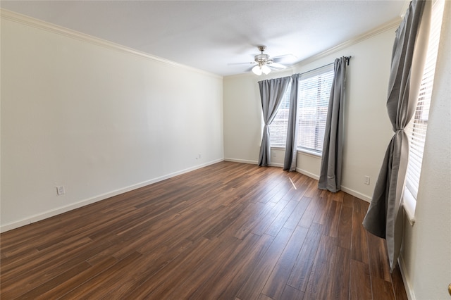 unfurnished room with crown molding, ceiling fan, and dark hardwood / wood-style floors