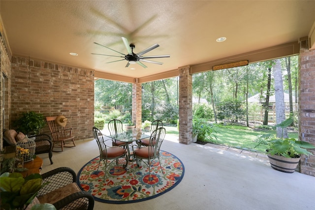 view of patio featuring ceiling fan