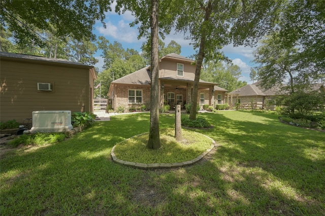 back of property featuring a lawn