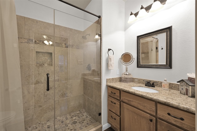 bathroom with vanity and an enclosed shower