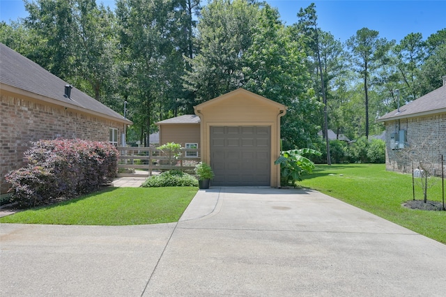 exterior space featuring a front lawn and a garage