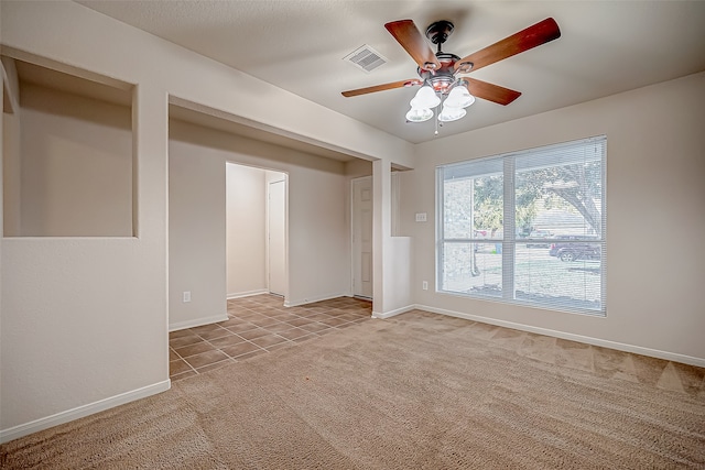 carpeted empty room with ceiling fan