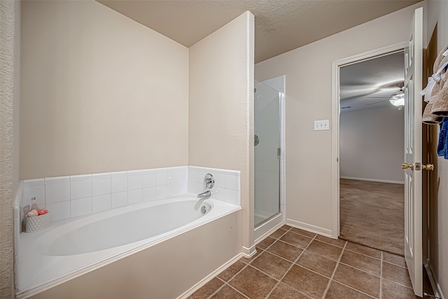 bathroom featuring tile patterned floors, plus walk in shower, a textured ceiling, and ceiling fan