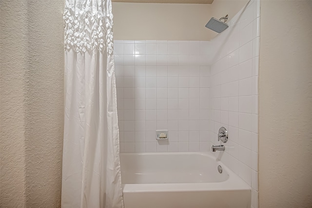 bathroom with shower / bathtub combination with curtain