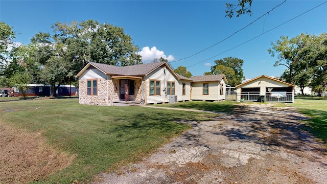 view of front facade with a front yard and a carport