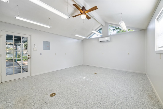 spare room featuring a wall mounted AC, a healthy amount of sunlight, lofted ceiling with beams, and ceiling fan