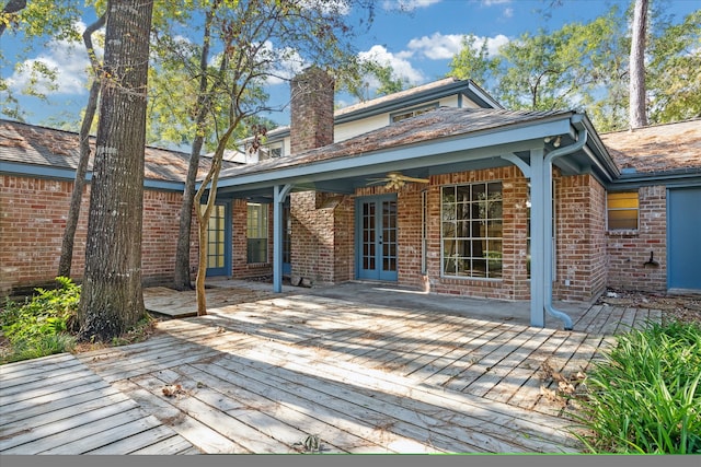 rear view of property featuring a deck