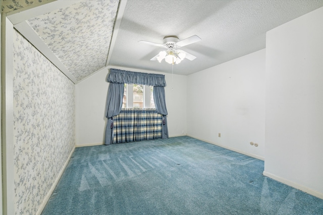 bonus room with lofted ceiling, carpet, a textured ceiling, and ceiling fan