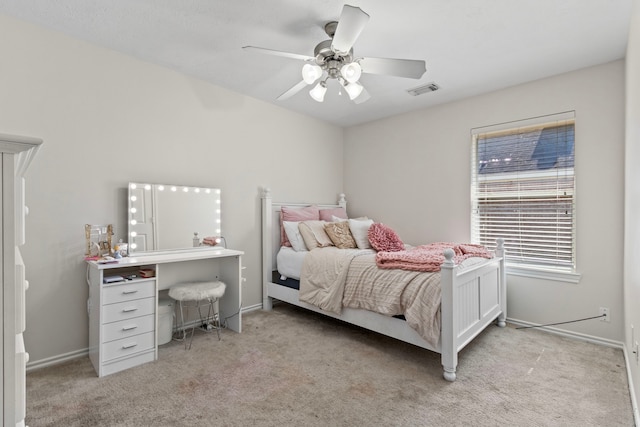 bedroom with light colored carpet and ceiling fan