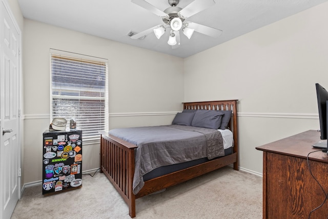 bedroom with light colored carpet and ceiling fan