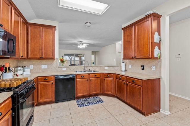 kitchen featuring decorative backsplash, ceiling fan, light tile patterned flooring, black appliances, and sink