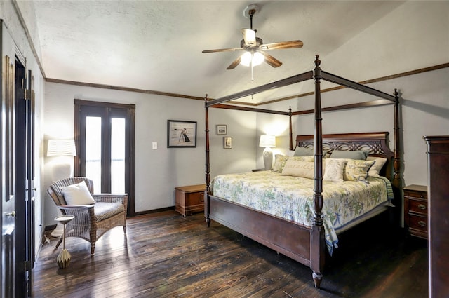 bedroom with ceiling fan, dark hardwood / wood-style floors, and vaulted ceiling