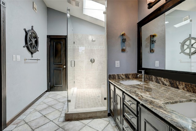 bathroom featuring vaulted ceiling, vanity, and an enclosed shower