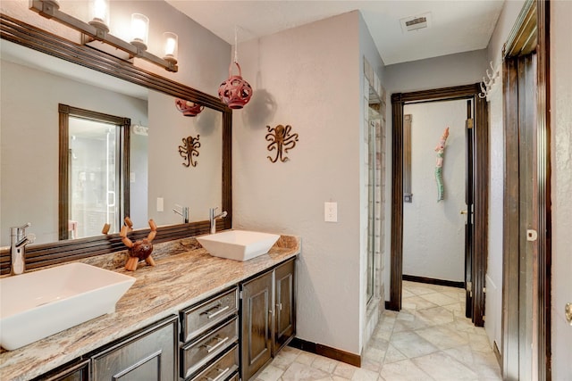 bathroom with vanity and an enclosed shower