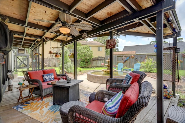 view of patio with an outdoor living space and a deck