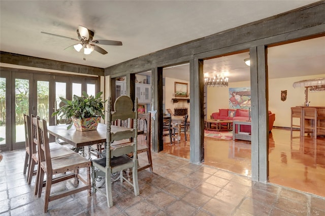 dining space featuring ceiling fan and french doors