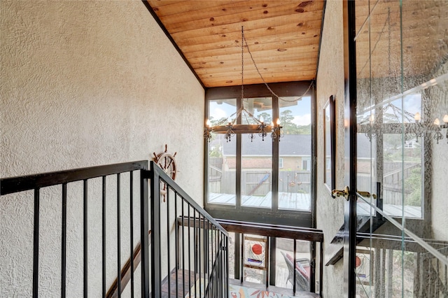 interior space with lofted ceiling and wood ceiling