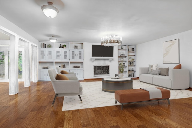 living room featuring wood-type flooring and a chandelier