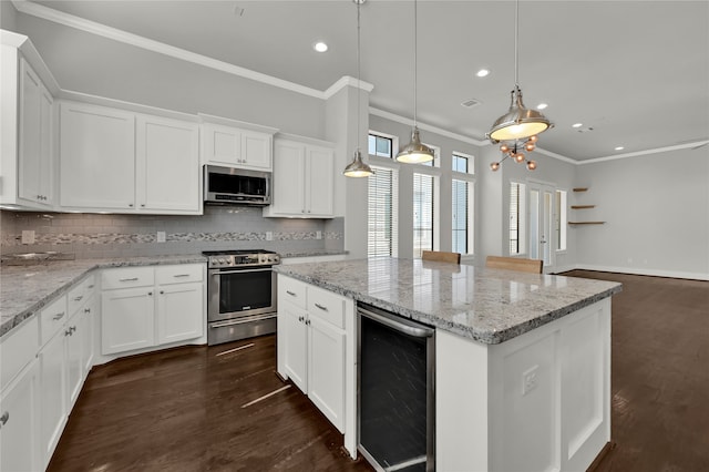 kitchen featuring white cabinets, stainless steel appliances, beverage cooler, and dark hardwood / wood-style floors