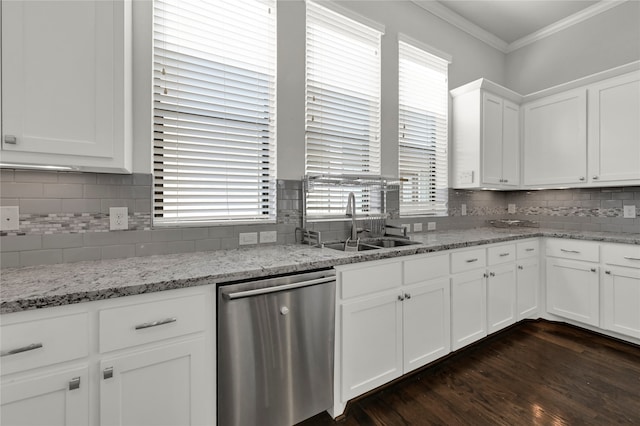 kitchen with backsplash, white cabinetry, stainless steel dishwasher, dark wood-type flooring, and ornamental molding