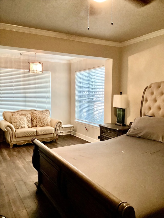 bedroom featuring crown molding and hardwood / wood-style flooring