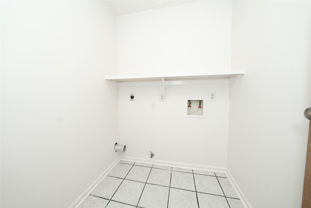 laundry area with hookup for a gas dryer, hookup for a washing machine, light tile patterned floors, and electric dryer hookup