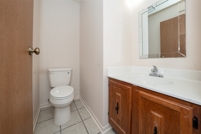 bathroom featuring vanity, toilet, and tile patterned floors