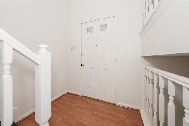 foyer entrance with light hardwood / wood-style flooring