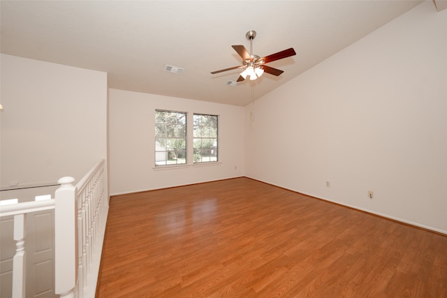 unfurnished room featuring lofted ceiling, light hardwood / wood-style flooring, and ceiling fan