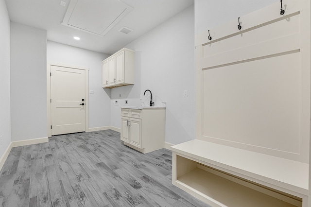 washroom with light hardwood / wood-style flooring