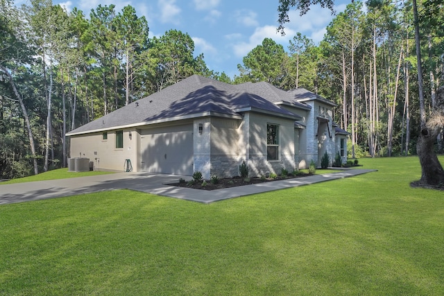 view of property exterior with a yard and central air condition unit