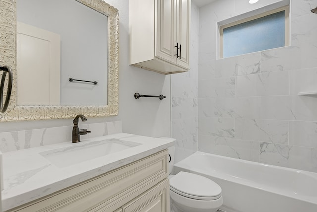 full bathroom with vanity, toilet, and tiled shower / bath