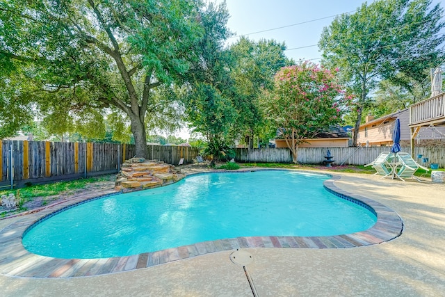 view of swimming pool with a patio area