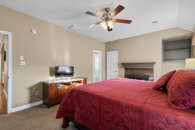 bedroom featuring light carpet, vaulted ceiling, and ceiling fan