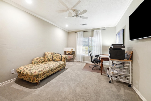 carpeted home office featuring crown molding, a textured ceiling, and ceiling fan