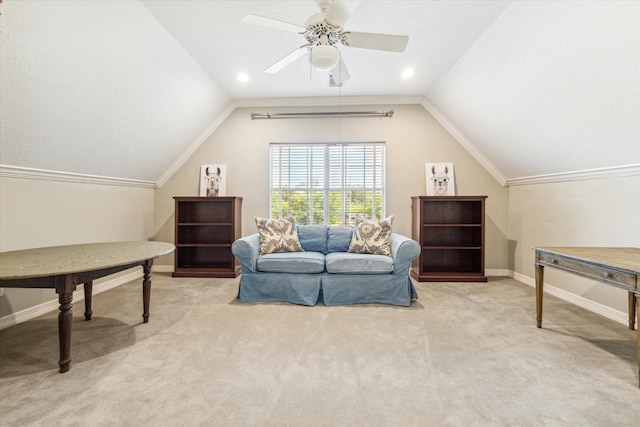 interior space featuring a textured ceiling, ceiling fan, light colored carpet, and vaulted ceiling