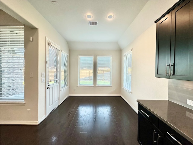 unfurnished dining area with dark hardwood / wood-style flooring